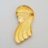 Goudkleurige broche vrouwenhoofd